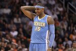 PHOENIX - NOVEMBER 15:  Carmelo Anthony #15 of the Denver Nuggets during the NBA game against the Phoenix Suns at US Airways Center on November 15, 2010 in Phoenix, Arizona.  The Suns defeated the Nuggets 100-94.  NOTE TO USER: User expressly acknowledges and agrees that, by downloading and or using this photograph, User is consenting to the terms and conditions of the Getty Images License Agreement.  (Photo by Christian Petersen/Getty Images)
