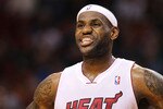 MIAMI, FL - JANUARY 31:  LeBron James #6 of the Miami Heat looks on during a game against the Cleveland Cavaliers at American Airlines Arena on January 31, 2011 in Miami, Florida. NOTE TO USER: User expressly acknowledges and agrees that, by downloading and/or using this Photograph, User is consenting to the terms and conditions of the Getty Images License Agreement.  (Photo by Mike Ehrmann/Getty Images)