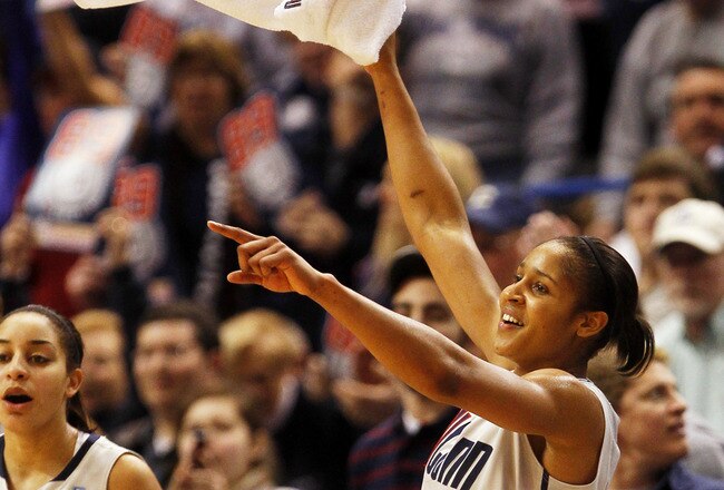 HARTFORD, CT - DECEMBER 21:  Maya Moore #23 of the Connecticut celebrates in the final minutes of a win over Florida State on December 21, 2010 in Hartford, Connecticut.  Connecticut set a record with 89 straight wins without a defeat. (Photo by Jim Rogash/Getty Images)