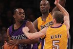 LOS ANGELES, CA - DECEMBER 03:  (L-R) Carl Landry #24 of the Sacramento Kings is defended by Lamar Odom #7 and Steve Blake #5 of the Los Angeles Lakers during the first half at Staples Center on December 3, 2010 in Los Angeles, California. The Lakers defeated the Kings 113-80. NOTE TO USER: User expressly acknowledges and agrees that, by downloading and or using this photograph, User is consenting to the terms and conditions of the Getty Images License Agreement.  (Photo by Jeff Gross/Getty Images)