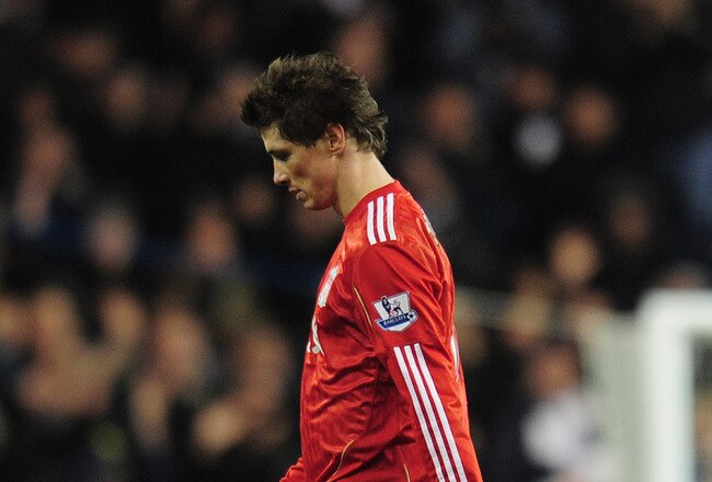 LONDON, ENGLAND - NOVEMBER 28:  Fernando Torres of Liverpool walks off the pitch dejected after defeat in the Barclays Premier League match between Tottenham Hotspur and Liverpool at White Hart Lane on November 28, 2010 in London, England.  (Photo by Shaun Botterill/Getty Images)