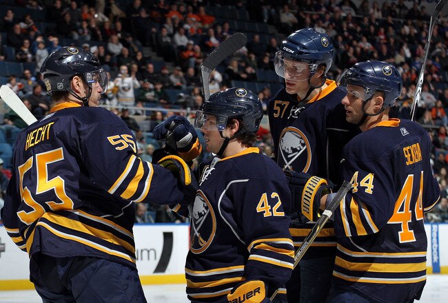 UNIONDALE, NY - JANUARY 23:  Nathan Gerbe #42 (C) of the Buffalo Sabres scores a third period goal against the New York Islanders at the Nassau Coliseum on January 23, 2011 in Uniondale, New York. The Sabres defeated the Islanders 5-3. (Photo by Bruce Bennett/Getty Images)