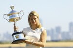MELBOURNE, AUSTRALIA - JANUARY 30:  Kim Clijsters of Belgium poses with the Daphne Akhurst Trophy after winning the 2011 Women's Australian Open final, at Brighton Beach on January 30, 2011 in Melbourne, Australia.  (Photo by Robert Prezioso/Getty Images)