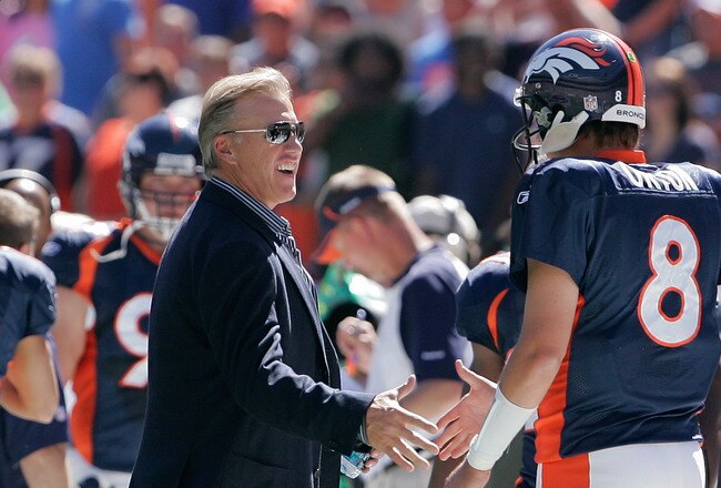 DENVER - SEPTEMBER 19:  Quarterback Kyle Orton #8 of the Denver Broncos shakes hands with former Denver Broncos quarterback John Elway before an NFL game against the Seattle Seahawks at INVESCO Field at Mile High on September 19, 2010 in Denver, Colorado.  (Photo by Justin Edmonds/Getty Images)