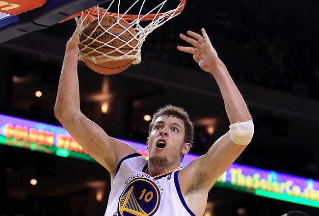 OAKLAND, CA - JANUARY 21:  David Lee #10 of the Golden State Warriors dunks the ball during their game against the Sacramento Kings at Oracle Arena on January 21, 2011 in Oakland, California. NOTE TO USER: User expressly acknowledges and agrees that, by downloading and or using this photograph, User is consenting to the terms and conditions of the Getty Images License Agreement.  (Photo by Ezra Shaw/Getty Images)