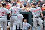 BALTIMORE - MAY 16:  Matt LaPorta #7 of the Cleveland Indians is congratulated by Mark Grudzielanek #12 and Lou Marson #30 after hitting a home run in the fifth inning against the Baltimore Orioles at Camden Yards on May 16, 2010 in Baltimore, Maryland.  (Photo by Greg Fiume/Getty Images)