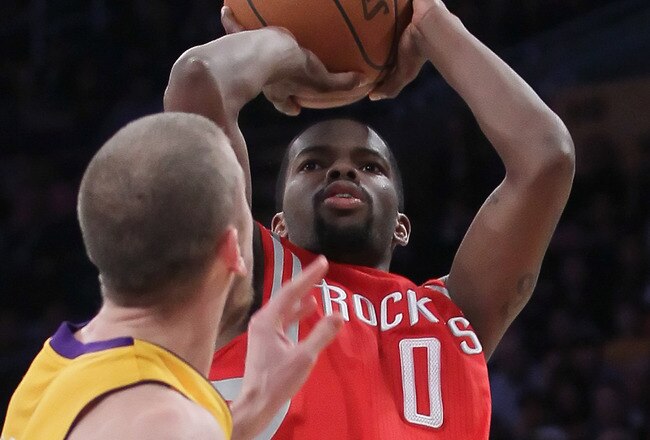 LOS ANGELES, CA - FEBRUARY 01:  Aaron Brooks #0 of the Houston Rockets shoots over Steve Blake #5 of the Los Angeles Lakers in the second half at Staples Center on February 1, 2011 in Los Angeles, California. The Lakers defeated the Rockets 114-106. NOTE TO USER: User expressly acknowledges and agrees that, by downloading and or using this photograph, User is consenting to the terms and conditions of the Getty Images License Agreement.  (Photo by Jeff Gross/Getty Images)
