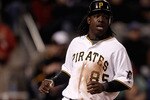 PITTSBURGH - MAY 08:  Lastings Milledge #85 of the Pittsburgh Pirates safely scores a run against the St Louis Cardinals during the game on May 8, 2010 at PNC Park in Pittsburgh, Pennsylvania.  (Photo by Jared Wickerham/Getty Images)