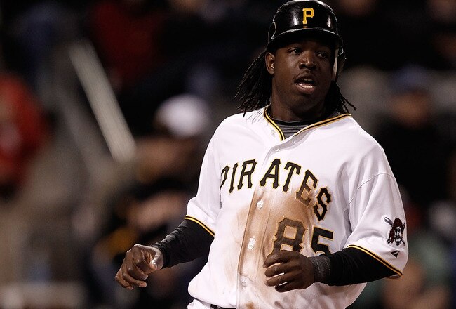 PITTSBURGH - MAY 08:  Lastings Milledge #85 of the Pittsburgh Pirates safely scores a run against the St Louis Cardinals during the game on May 8, 2010 at PNC Park in Pittsburgh, Pennsylvania.  (Photo by Jared Wickerham/Getty Images)
