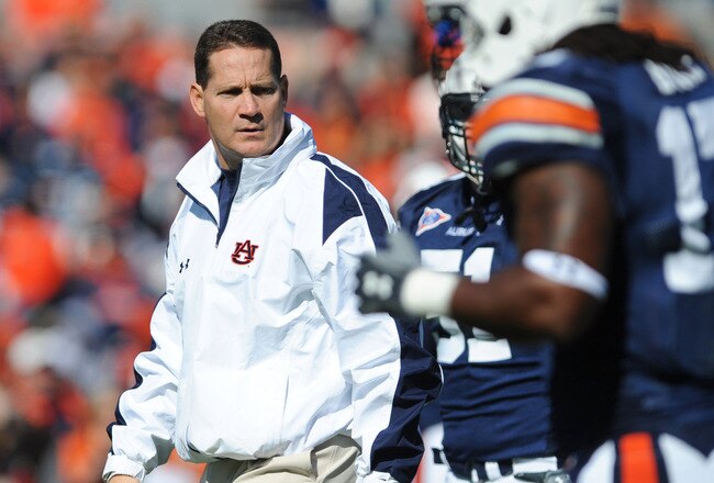 AUBURN, AL - NOVEMBER 06:  Coach Gene Chizik of the Auburn Tigers watches warmups before play against the Chattanooga Mocs November 6, 2010 at Jordan-Hare Stadium in Auburn, Alabama.  (Photo by Al Messerschmidt/Getty Images)