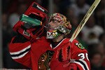 CHICAGO, IL - DECEMBER 30: Marty Turco #30 of the Chicago Blackhawks drinks water during a break in the action against the San Jose Sharks at the United Center on December 30, 2010 in Chicago, Illinois. The Sharks defeated the Blackhawks 5-3. (Photo by Jonathan Daniel/Getty Images)