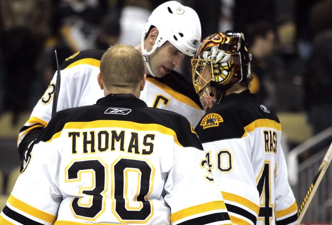 PITTSBURGH, PA - JANUARY 10:  Tuukka Rask #40 celebrates with Zdeno Chara #33 and Tim Thomas #30 of the Boston Bruins against the Pittsburgh Penguins on January 10, 2011 at Consol Energy Center in Pittsburgh, Pennsylvania.  The Bruins defeated the Penguins 4-2.  (Photo by Justin K. Aller/Getty Images)