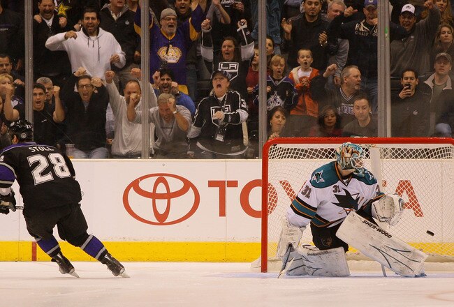 LOS ANGELES, CA - JANUARY 26:  Jarret Stoll #28 of the Los Angeles Kings scores a goal during the overtime shootout against Antti Niemi #31 of the San Jose Sharks at Staples Center on January 26, 2011 in Los Angeles, California. The Kings defeated the Sharks 3-2 in an overtime shootout.  (Photo by Victor Decolongon/Getty Images)
