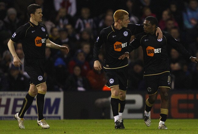 WEST BROMWICH, ENGLAND - FEBRUARY 01:  Ben Watson of Wigan congratulates Charles N'Zogbia on scoring thier first goal during the Barclays Premier League match between West Bromwich Albion and Wigan Athletic at The Hawthorns on February 1, 2011 in West Bromwich, England.  (Photo by Richard Heathcote/Getty Images)