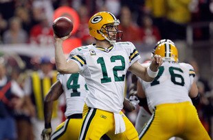 ATLANTA, GA - JANUARY 15:  Quarterback Aaron Rodgers #12  of the Green Bay Packers throws a pass against the Atlanta Falcons during their 2011 NFC divisional playoff game at Georgia Dome on January 15, 2011 in Atlanta, Georgia.  (Photo by Kevin C. Cox/Getty Images)
