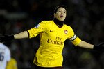 LEEDS, ENGLAND - JANUARY 19:  Samir Nasri of Arsenal celebrates scoring the opening goal during the FA Cup sponsored by E.On Third Round Replay match between Leeds United and Arsenal at Elland Road on January 19, 2011 in Leeds, England.  (Photo by Michael Regan/Getty Images)