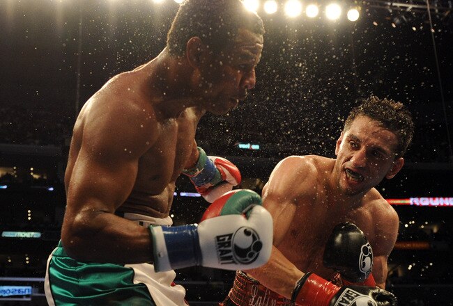LOS ANGELES, CA - SEPTEMBER 18:  Sergio Mora punches Shane Mosley during the eighth round in a Middleweight bout at Staples Center on September 18, 2010 in Los Angeles, California.  The fight ended in a draw.  (Photo by Harry How/Getty Images)