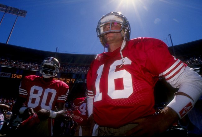 16 Sep 1990:  San Francisco 49ers wide receiver Jerry Rice (left) and quarterback Joe Montana look on during a game against the Washington Redskins at RFK Stadium in Washington, D. C.  The 49ers won the game, 26-13. Mandatory Credit: Mike Powell  /Allspor