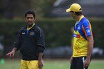 CAPE TOWN, SOUTH AFRICA - APRIL 16:  Mahendra Singh Dhoni of Chennai chats to coach Stephen Fleming during the Chennai Super Kings training session at the Vineyard Cricket Ground on April 16, 2009 in Cape Town, South Africa.  (Photo by Tom Shaw/Getty Images)