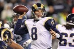 SEATTLE, WA - JANUARY 02:  Quarterback Sam Bradford #8 of the St. Louis Rams looks to pass against the Seattle Seahawks during their game at Qwest Field on January 2, 2011 in Seattle, Washington.  (Photo by Otto Greule Jr/Getty Images)