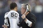 15 Dec 2001:   Chuck Bresnahan defensive coordinator for the Oakland Raiders talks with linebacker Eric Barton #50  during their game at Qualcomm Stadium in San Diego, California.  The Raiders won 13-6. DIGITAL IMAGE   Mandatory Credit:  Stephen Dunn/ALLSPORT