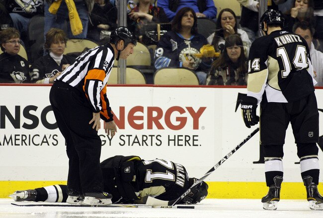 PITTSBURGH, PA - FEBRUARY 04:  Evgeni Malkin #71 of the Pittsburgh Penguins lies injured on the ice during the game against the Buffalo Sabres at Consol Energy Center on February 4, 2011 in Pittsburgh, Pennsylvania.  The Penguins defeated Buffalo 3-2.  (Photo by Justin K. Aller/Getty Images)