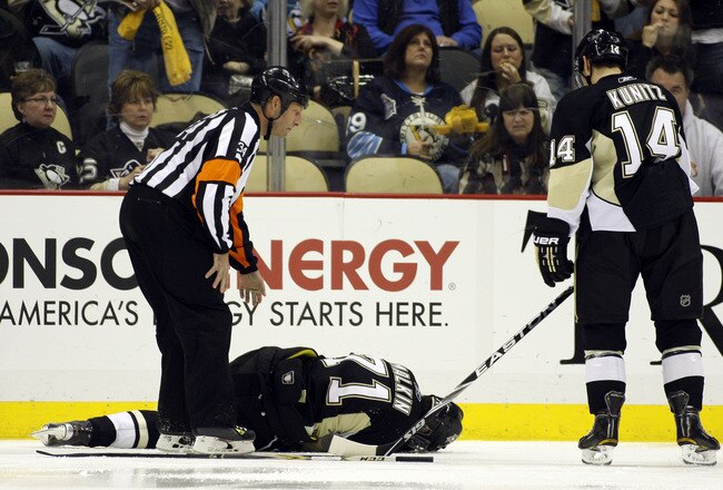 PITTSBURGH, PA - FEBRUARY 04:  Evgeni Malkin #71 of the Pittsburgh Penguins lies injured on the ice during the game against the Buffalo Sabres at Consol Energy Center on February 4, 2011 in Pittsburgh, Pennsylvania.  The Penguins defeated Buffalo 3-2.  (Photo by Justin K. Aller/Getty Images)