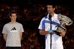 MELBOURNE, AUSTRALIA - JANUARY 30:  Novak Djokovic of Serbia (R) poses with the Norman Brookes Challenge Cup after winning his men's final match against Andy Murray of Great Britain (L) during day fourteen of the 2011 Australian Open at Melbourne Park on January 30, 2011 in Melbourne, Australia.  (Photo by Clive Brunskill/Getty Images)