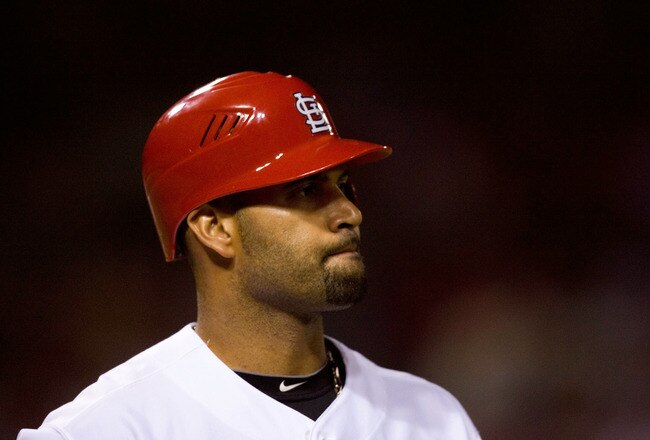 ST. LOUIS - JULY 2: Albert Pujols #5 of the St. Louis Cardinals reacts to striking out against the Milwaukee Brewers at Busch Stadium on July 2, 2010 in St. Louis, Missouri.  The Cardinals beat the Brewers 5-0.  (Photo by Dilip Vishwanat/Getty Images)