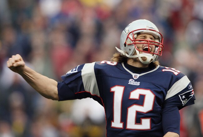 FOXBORO, MA - JANUARY 02:  Tom Brady #12 of the New England Patriots celebrates a touchdown by teammate BenJarvis Green-Ellis in the first quarter against the Miami Dolphins on January 2, 2011 at Gillette Stadium in Foxboro, Massachusetts.  (Photo by Elsa/Getty Images)