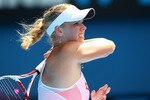 MELBOURNE, AUSTRALIA - JANUARY 27:  Caroline Wozniacki of Denmark plays a forehand in her semifinal match against Na Li of China during day eleven of the 2011 Australian Open at Melbourne Park on January 27, 2011 in Melbourne, Australia.  (Photo by Cameron Spencer/Getty Images)