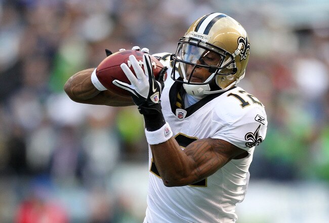 SEATTLE, WA - JANUARY 08:  Marques Colston #12 of the New Orleans Saints catches a pass against the Seattle Seahawks during the 2011 NFC wild-card playoff game at Qwest Field on January 8, 2011 in Seattle, Washington.  (Photo by Otto Greule Jr/Getty Images)
