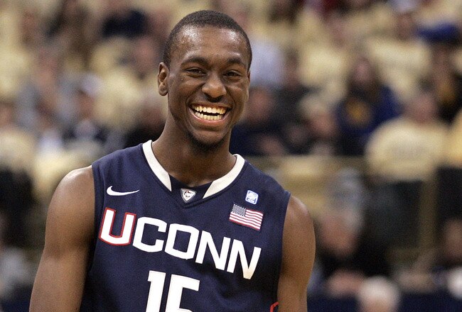 PITTSBURGH, PA - DECEMBER 27:  Travon Woodall #1 of the Pittsburgh Panthers and Kemba Walker #15 of the Connecticut Huskies have a laugh at Petersen Events Center on December 27, 2010 in Pittsburgh, Pennsylvania.  Pittsburgh defeated Connecticut 78-64.  (Photo by Justin K. Aller/Getty Images)