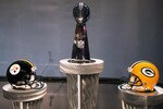 DALLAS, TX - FEBRUARY 04:  The Vince Lombardi Trophy is displayed between a Pittsburgh Steelers helmet and a Green Bay Packers helmet during a press conference with NFL commissioner Roger Goodell at the Super Bowl XLV media center on February 4, 2011 in Dallas, Texas. The Green Bay Packers will play the Pittsburgh Steelers in Super Bowl XLV on February 6, 2011 at Cowboys Stadium in Arlington, Texas.  (Photo by Doug Pensinger/Getty Images)