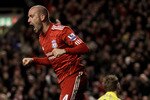LIVERPOOL, ENGLAND - JANUARY 26:  Raul Meireles of Liverpool celebrates after John Pantsil of Fulham scored an own goal during the Barclays Premier League match between Liverpool and Fulham at Anfield on January 26, 2011 in Liverpool, England.  (Photo by Alex Livesey/Getty Images)