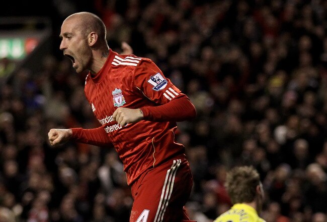 LIVERPOOL, ENGLAND - JANUARY 26:  Raul Meireles of Liverpool celebrates after John Pantsil of Fulham scored an own goal during the Barclays Premier League match between Liverpool and Fulham at Anfield on January 26, 2011 in Liverpool, England.  (Photo by Alex Livesey/Getty Images)