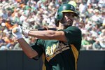 PHOENIX - MARCH 17:  Eric Chavez #3 of the Oakland Athletics warms up on deck during the MLB spring training game against the San Francisco Giants at Phoenix Municipal Stadium on March 17, 2010 in Phoenix, Arizona. The Giants defeated the A's 6-1.  (Photo by Christian Petersen/Getty Images)