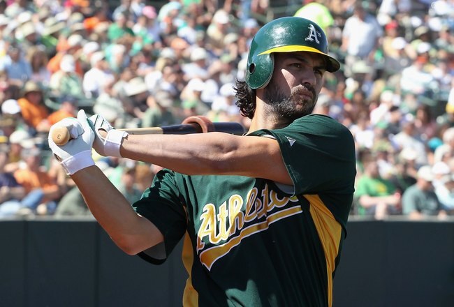 PHOENIX - MARCH 17:  Eric Chavez #3 of the Oakland Athletics warms up on deck during the MLB spring training game against the San Francisco Giants at Phoenix Municipal Stadium on March 17, 2010 in Phoenix, Arizona. The Giants defeated the A's 6-1.  (Photo by Christian Petersen/Getty Images)
