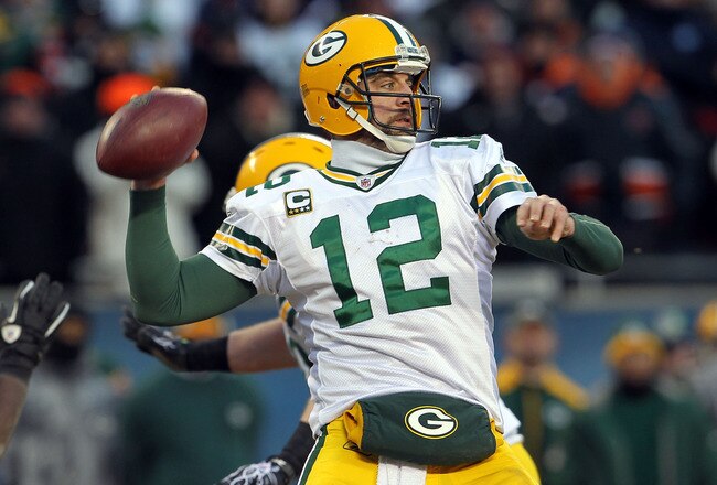 CHICAGO, IL - JANUARY 23:  Quarterback Aaron Rodgers #12 of the Green Bay Packers looks to pass against the Chicago Bears in the NFC Championship Game at Soldier Field on January 23, 2011 in Chicago, Illinois.  (Photo by Jamie Squire/Getty Images)