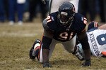 CHICAGO, IL - JANUARY 16:  Tommie Harris #91 of the Chicago Bears reacts after a sack of quarterback Matt Hasselbeck #8 of the Seattle Seahawks in the 2011 NFC divisional playoff game at Soldier Field on January 16, 2011 in Chicago, Illinois.  (Photo by Jonathan Daniel/Getty Images)