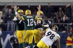 ARLINGTON, TX - FEBRUARY 06: Aaron Rodgers #12 of the Green Bay Packers celebrates late in the game against the Pittsburgh Steelers during Super Bowl XLV at Cowboys Stadium on February 6, 2011 in Arlington, Texas.  (Photo by Al Bello/Getty Images)