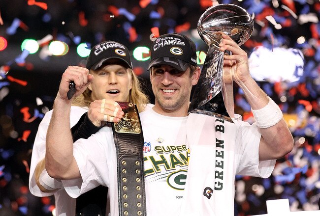ARLINGTON, TX - FEBRUARY 06:  Super Bowl MVP Aaron Rodgers #12 of the Green Bay Packers holds up the Vince Lombardi Trophy as Clay Matthews #52 looks on after winning Super Bowl XLV 31-25 against the Pittsburgh Steelers at Cowboys Stadium on February 6, 2011 in Arlington, Texas.  (Photo by Al Bello/Getty Images)