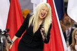 ARLINGTON, TX - FEBRUARY 06:  Singer Christina Aguilera performs during the Bridgestone Super Bowl XLV Pregame Show at Dallas Cowboys Stadium on February 6, 2011 in Arlington, Texas.  (Photo by Christopher Polk/Getty Images)