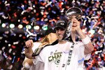ARLINGTON, TX - FEBRUARY 06:  MVP Aaron Rodgers #12 of the Green Bay Packers celebrates with the Lombardi Trophy after winning Super Bowl XLV against the Pittsburgh Steelers at Cowboys Stadium on February 6, 2011 in Arlington, Texas.  (Photo by Al Bello/Getty Images)