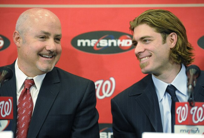 WASHINGTON, DC - DECEMBER 15:  Executive Vice President of Baseball Operations and General Manager Mike Rizzo introduces Jayson Werth #28  of the Washington Nationals to the media on December 15, 2010 at Nationals Park in Washington, DC.   (Photo by Mitchell Layton/Getty Images)