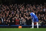 LONDON, ENGLAND - FEBRUARY 06:  Liverpool fans gestures towards Fernando Torres of Chelsea during the Barclays Premier League match between Chelsea and Liverpool at Stamford Bridge on February 6, 2011 in London, England.  (Photo by Scott Heavey/Getty Images)