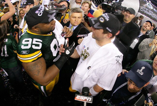 ARLINGTON, TX - FEBRUARY 06: Howard Green #95 and Super Bowl MVP Aaron Rodgers #12 of the Green Bay Packers celebrate after winning Super Bowl XLV against the Pittsburgh Steelers at Cowboys Stadium on February 6, 2011 in Arlington, Texas.  (Photo by Al Bello/Getty Images)