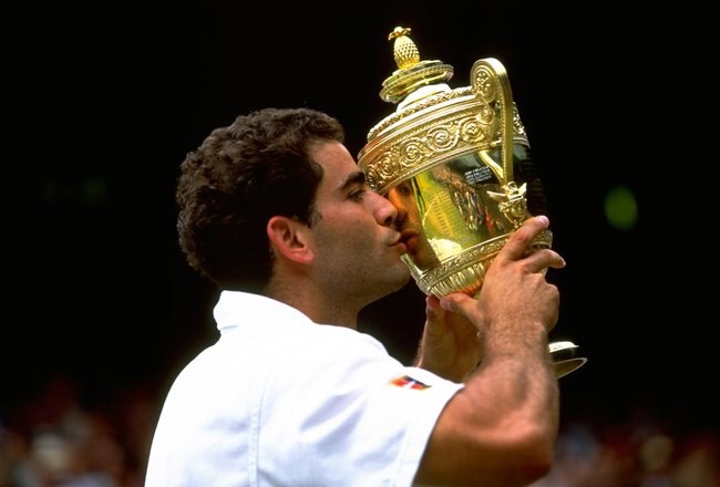 5 Jul 1998:    Pete Sampras kisses the trophyduring the 1998 Wimbledon Championships played at Wimbledon, London, England. \ Mandatory Credit: Gary M Prior/Allsport