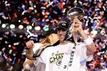 ARLINGTON, TX - FEBRUARY 06:  MVP Aaron Rodgers #12 of the Green Bay Packers celebrates with the Lombardi Trophy after winning Super Bowl XLV against the Pittsburgh Steelers at Cowboys Stadium on February 6, 2011 in Arlington, Texas.  (Photo by Al Bello/Getty Images)