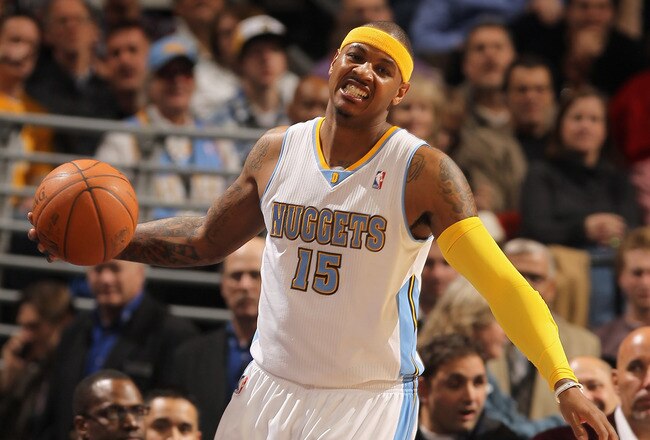 DENVER, CO - JANUARY 13:  Carmelo Anthony #15 of the Denver Nuggets reacts as the ball goes out of bounds against the Miami Heat at the Pepsi Center on January 13, 2011 in Denver, Colorado. The Nuggets defeated the Heat 130-102. NOTE TO USER: User expressly acknowledges and agrees that, by downloading and or using this photograph, User is consenting to the terms and conditions of the Getty Images License Agreement.  (Photo by Doug Pensinger/Getty Images)